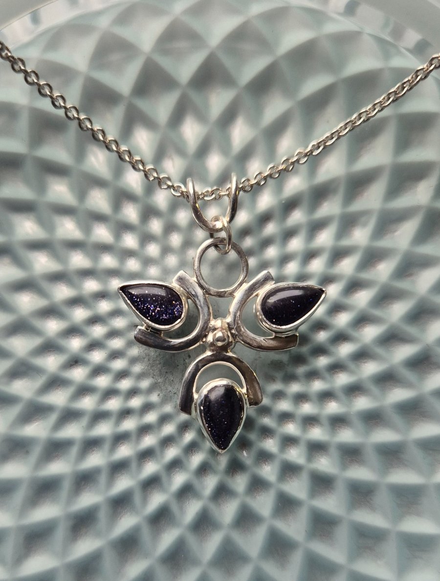 Sterling silver 3 petal flower pendant with blue goldstone 
