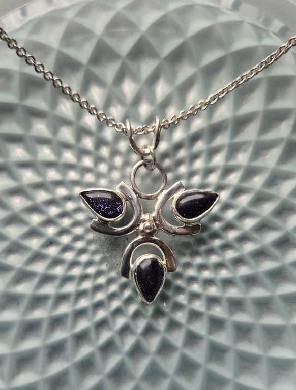Sterling silver 3 petal flower pendant with blue goldstone 