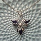 Sterling silver 3 petal flower pendant with blue goldstone 