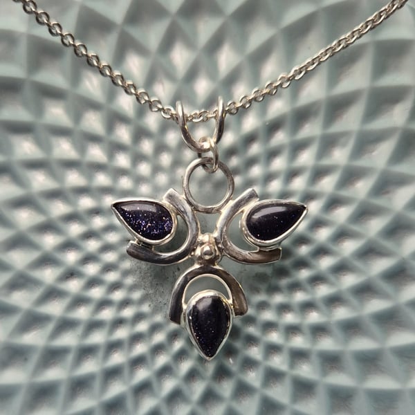 Sterling silver 3 petal flower pendant with blue goldstone 