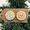 Set of two pottery magnets Sun and Moon on a Christmas gift tag