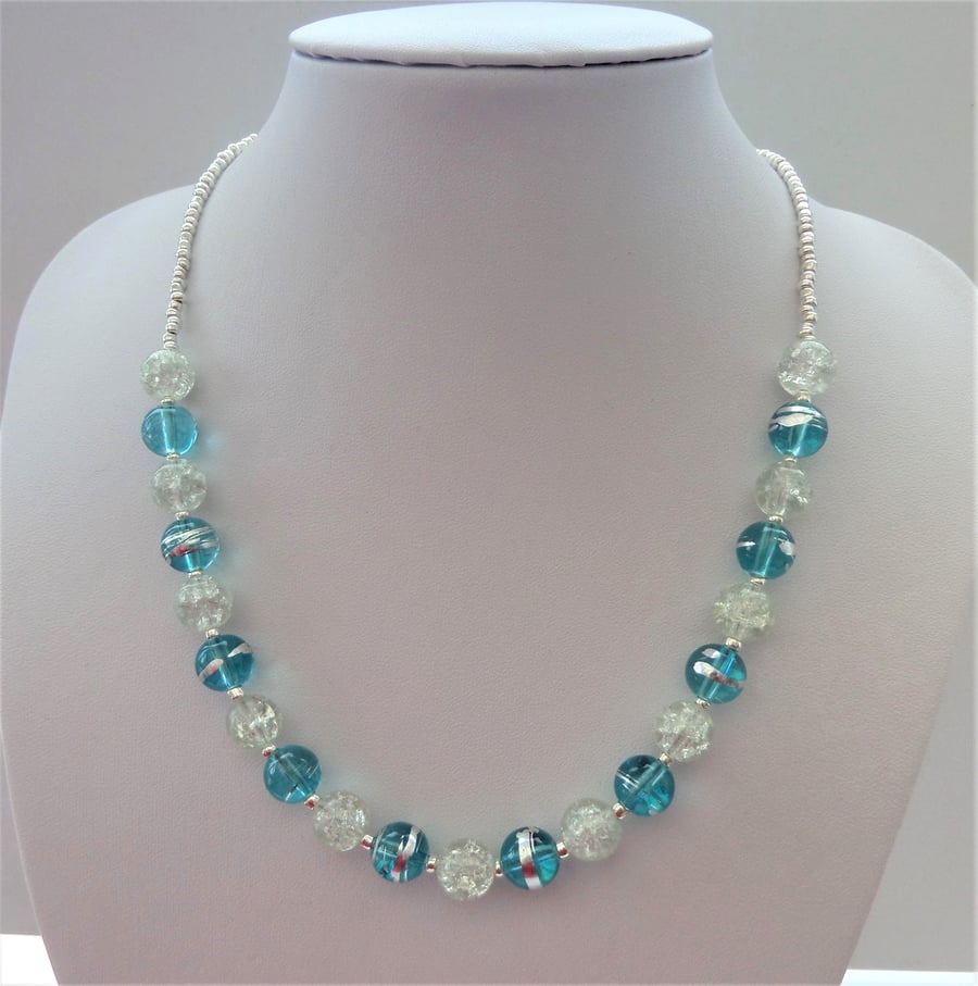 Light blue and clear crackle and silver bead necklace.