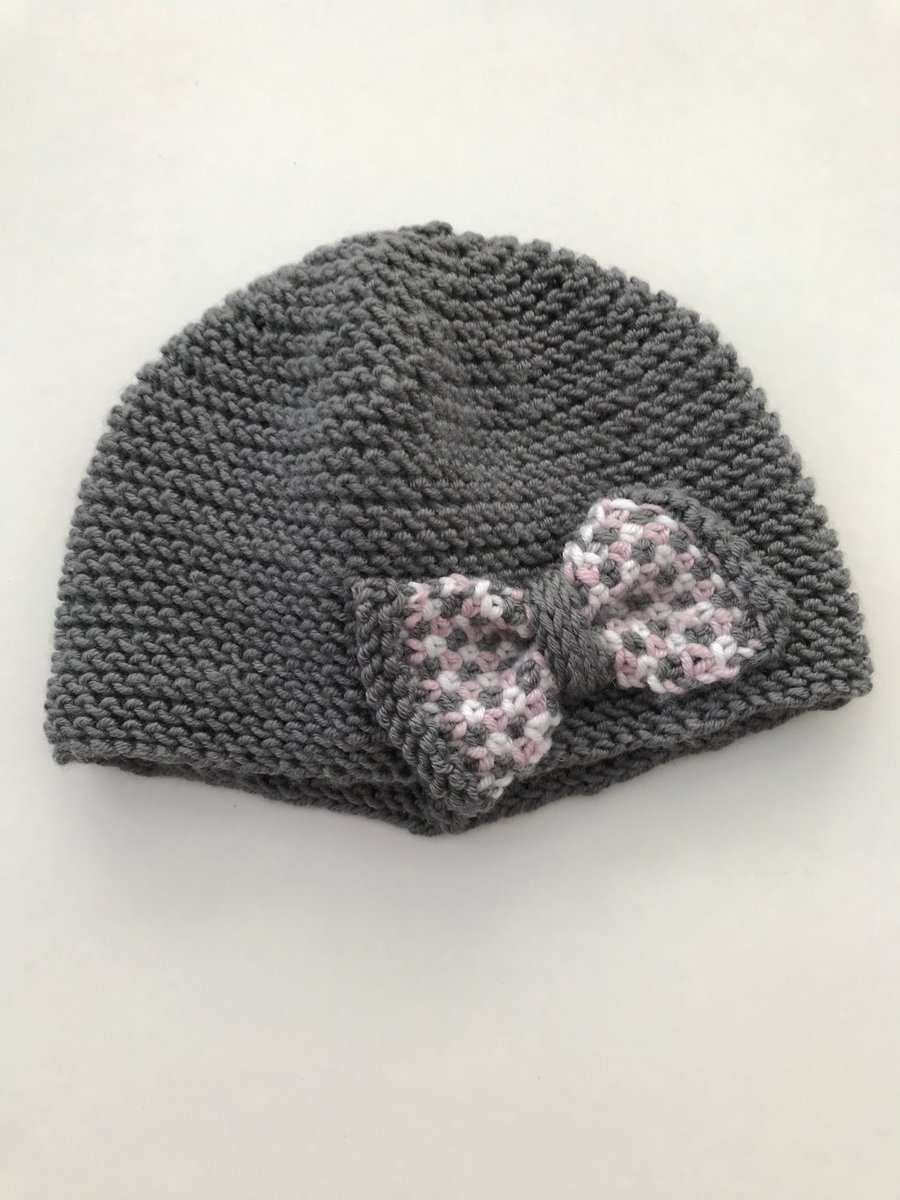 Hand knitted baby cloche hat with bow