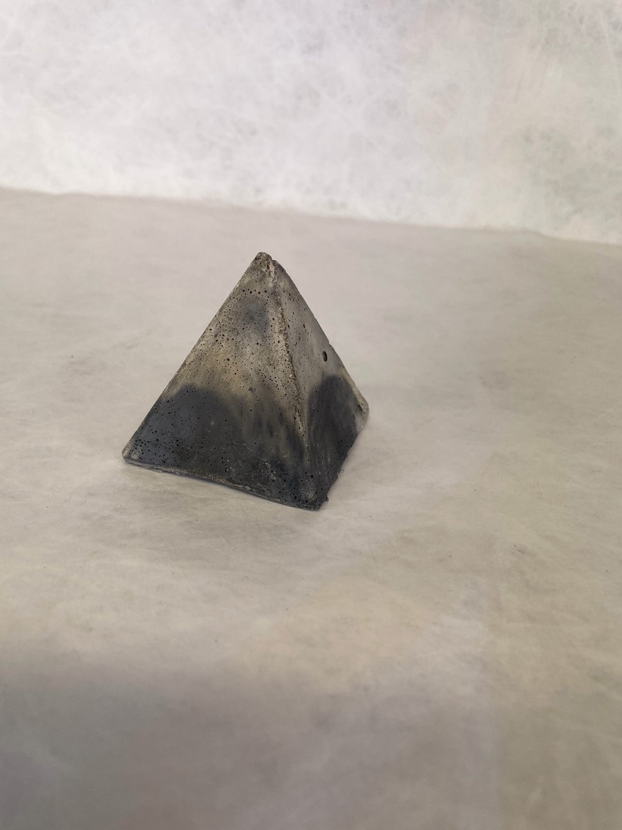 Pyramid made from traditional concrete mixtures indoor or garden ornament