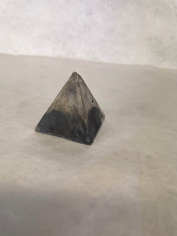 Pyramid made from traditional concrete mixtures indoor or garden ornament