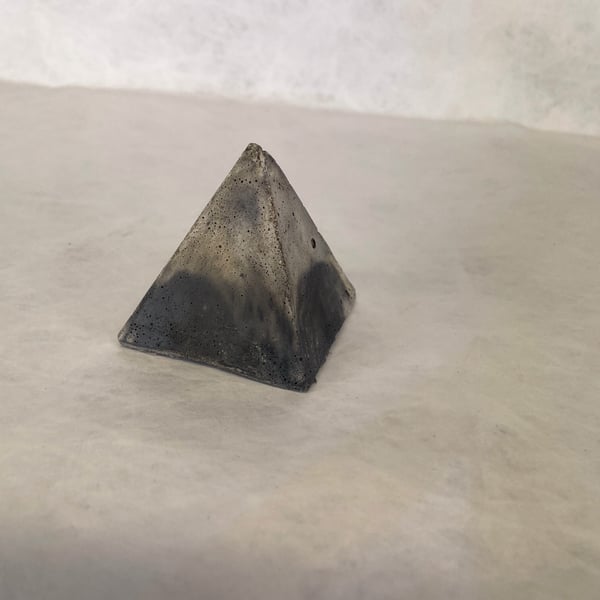 Pyramid made from traditional concrete mixtures indoor or garden ornament