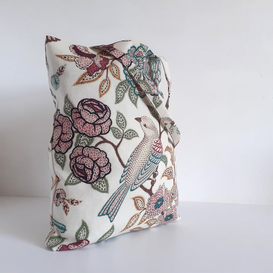 Tote or book bag upcycled in a bird and flower print remnant, with fold up pouch