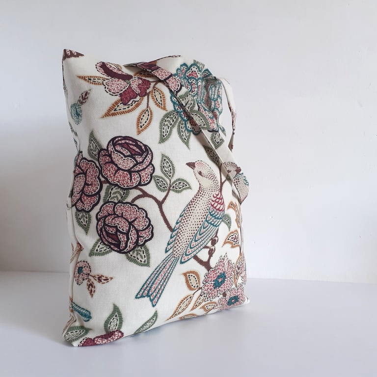 Tote or book bag upcycled in a bird and flower print remnant, with fold up pouch