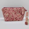 Make up bag in dark pink printed linen fabric