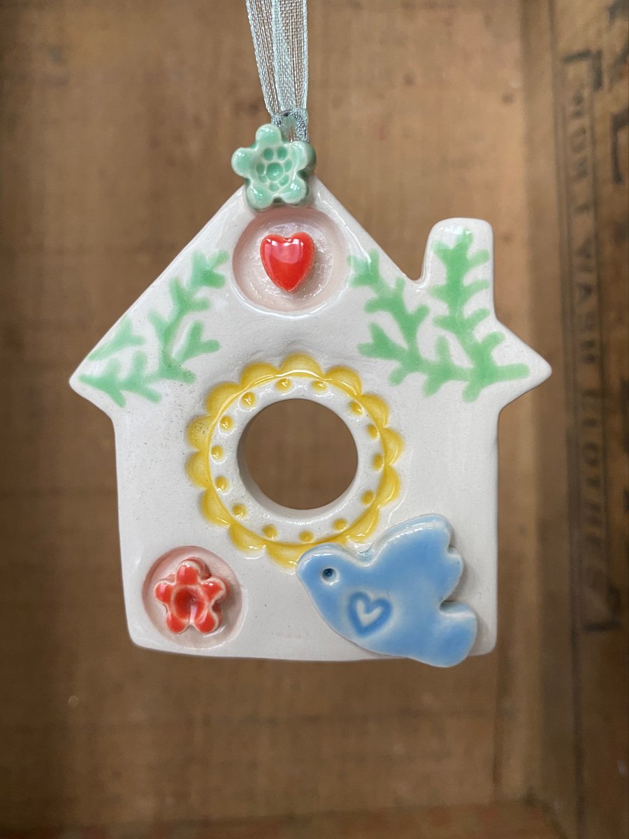 Small Ceramic bird house decoration with small blue bird