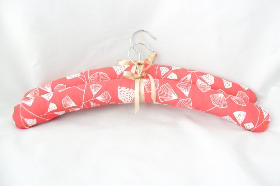 Padded coat hangers in coral pink