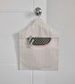 Peg bag in striped canvas fabric with dark green lining and red trim. - Image 1