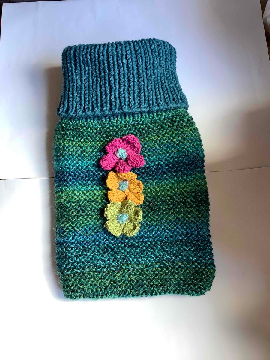 Cosy hand knitted chunky hot water bottle cover