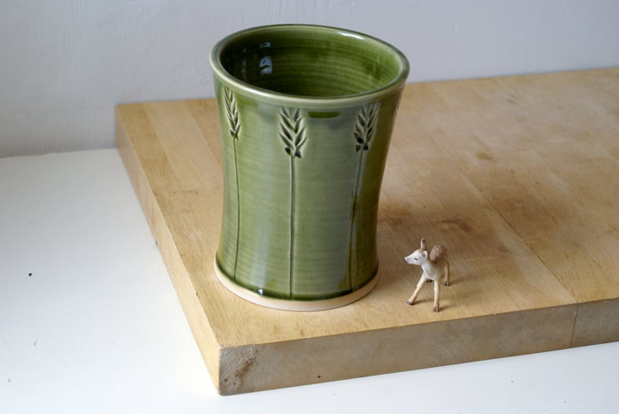 Stoneware pottery utensil holder in glossy forest green with ears of wheat