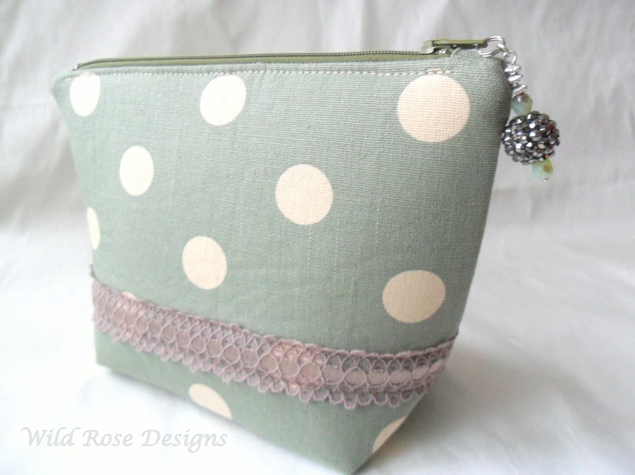 Green spotty make-up bag