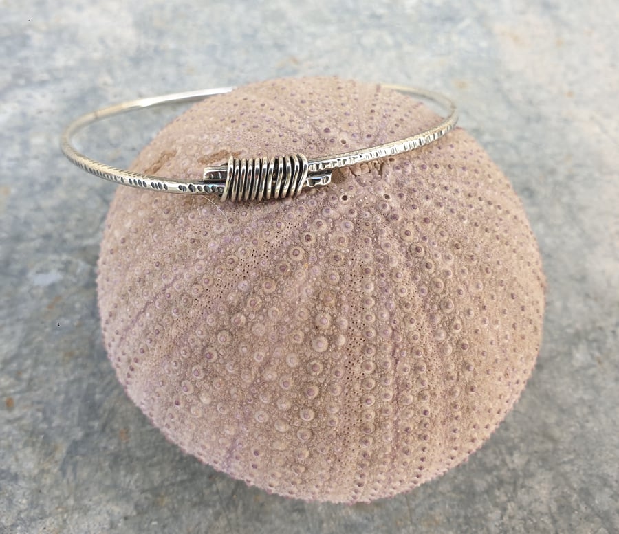 Sterling silver textured bangle with wire wrapping