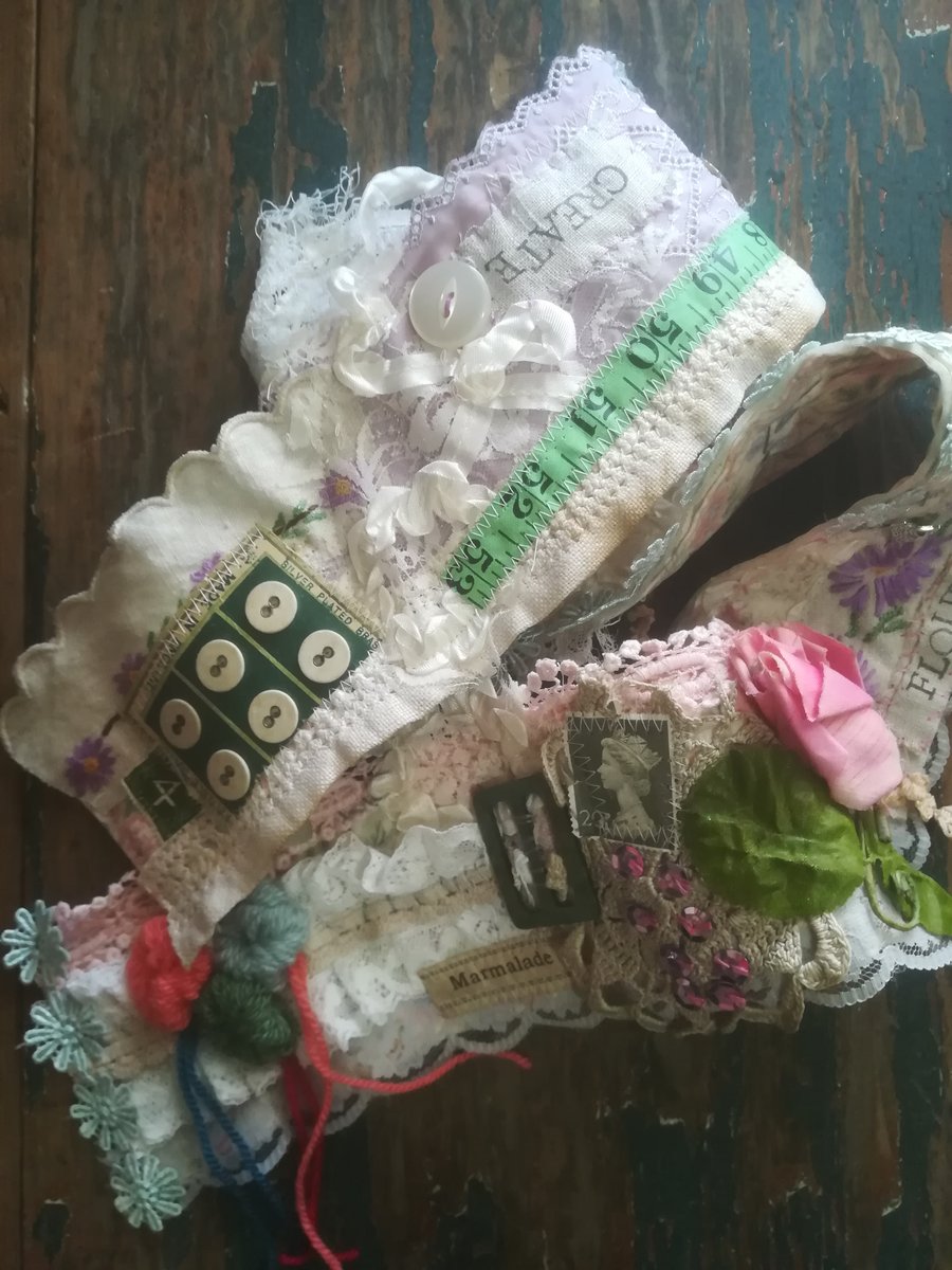 A OOAK vintage textile and ephemera snippet roll, journalling, decorating etc