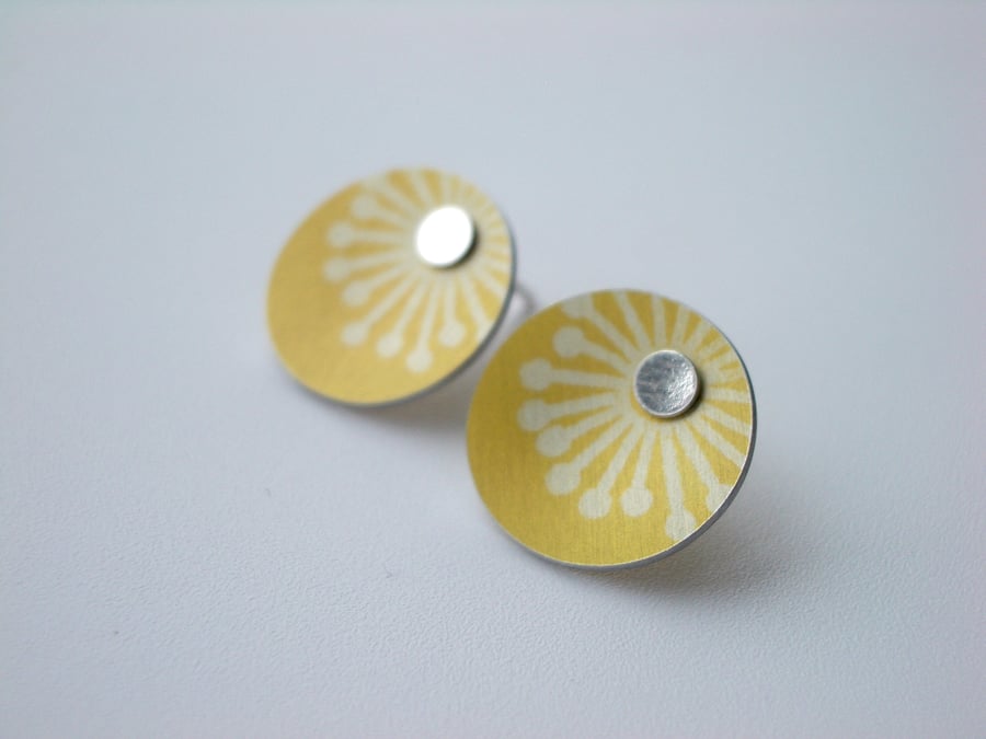 Yellow stud earrings with starburst print