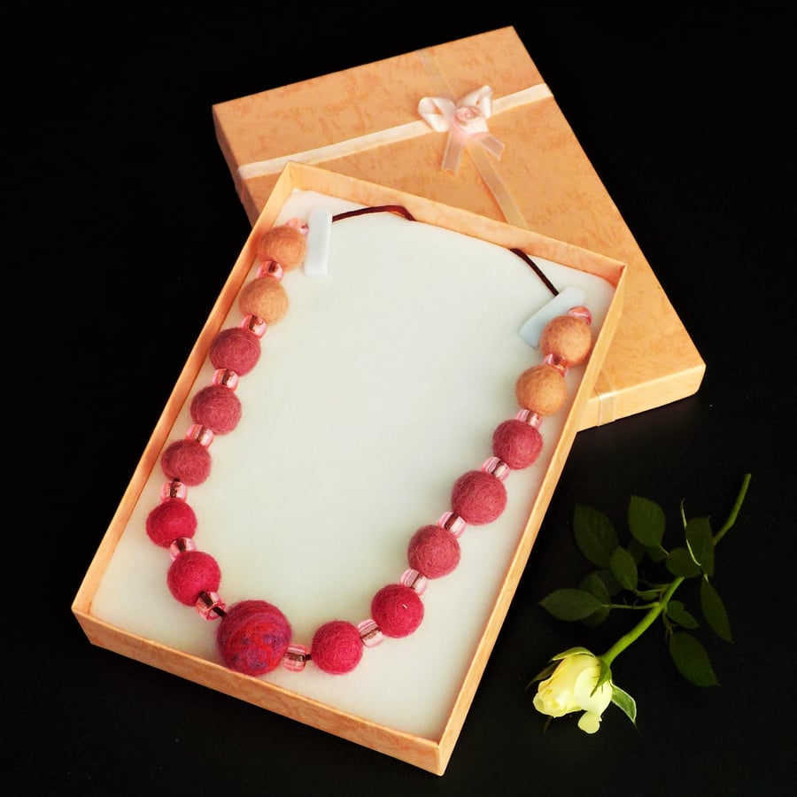 Handmade felt necklace peach pink beads in gift box.