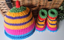HAND KNITTED DESIGNER BABY  HATS,  BOOTIES AND MITTENS