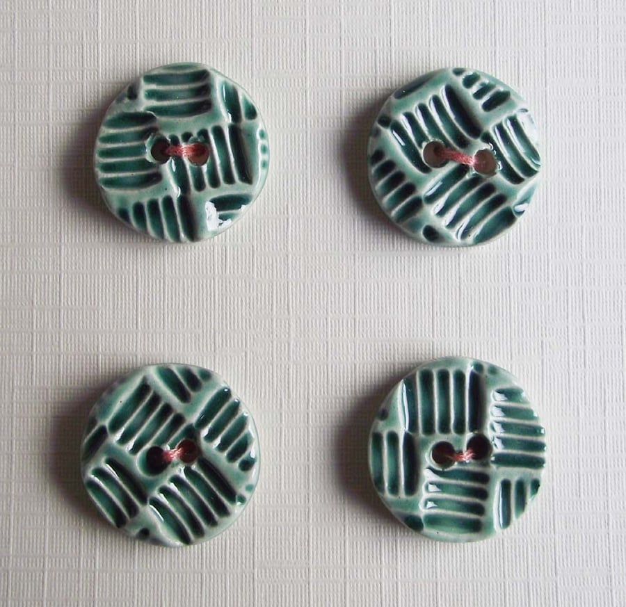 Set of four little handmade ceramic buttons
