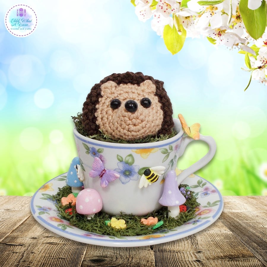 Crochet hedgehog in a miniature teacup. Hedgehog ornament. Hedgehog decoration.