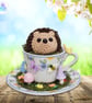 Crochet hedgehog in a miniature teacup. Hedgehog ornament. Hedgehog decoration.