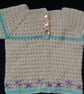 Crochet Baby jumper in cream with mauve embroidered flowers 22 in chest.  - Image 3