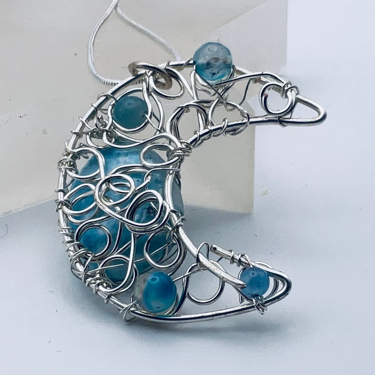 Pale blue gemstone and silver crescent moon wire wrapped pendant