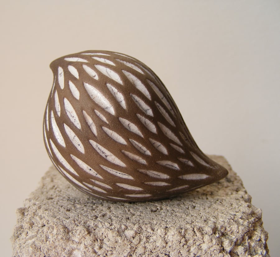 White, baby carved raku bird