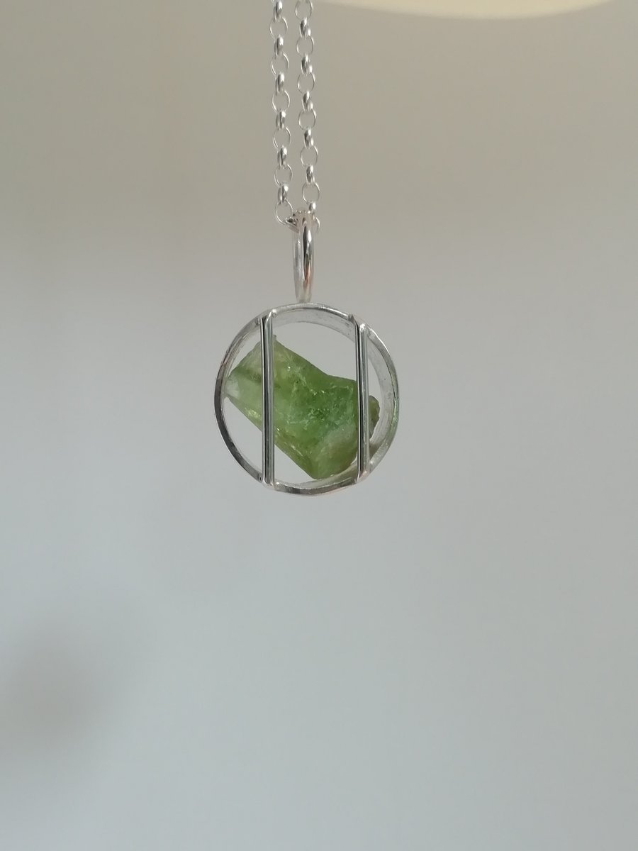 Raw Peridot Caged in a Silver Ring Necklace