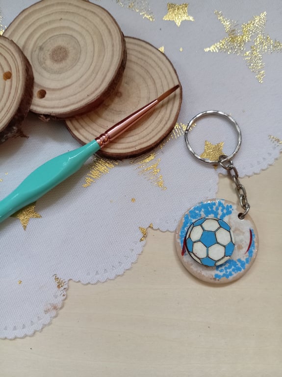 Wooden circular light blue football keyring 