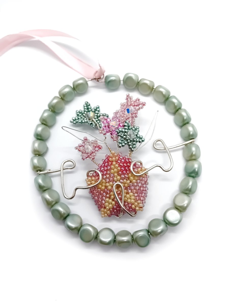 Pastel green and pink beaded and wire flower hanging decoration