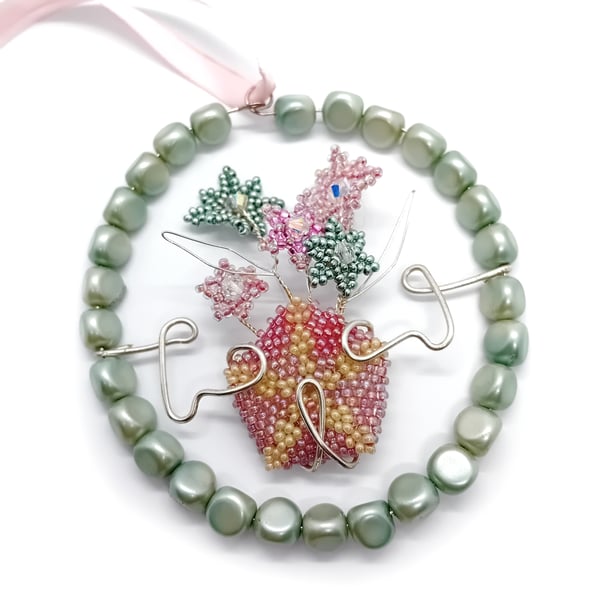 Pastel green and pink beaded and wire flower hanging decoration