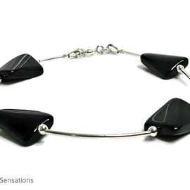 Glossy Twisted Black Onyx Oblongs Bangle Style Bracelet With Sterling Silver