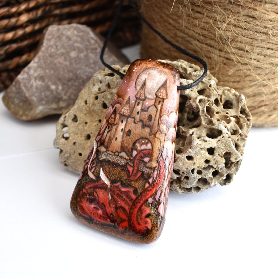 Pyrography fairytale sleeping dragon and castle. Long wooden prography pendant.