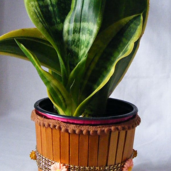 Handmade metallic gold indoor plant pot holder. 