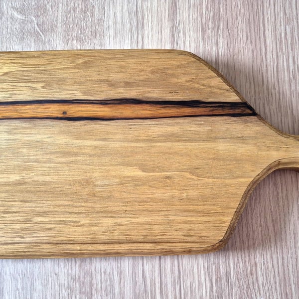 Beautiful unique chopping board made from black limba wood. 