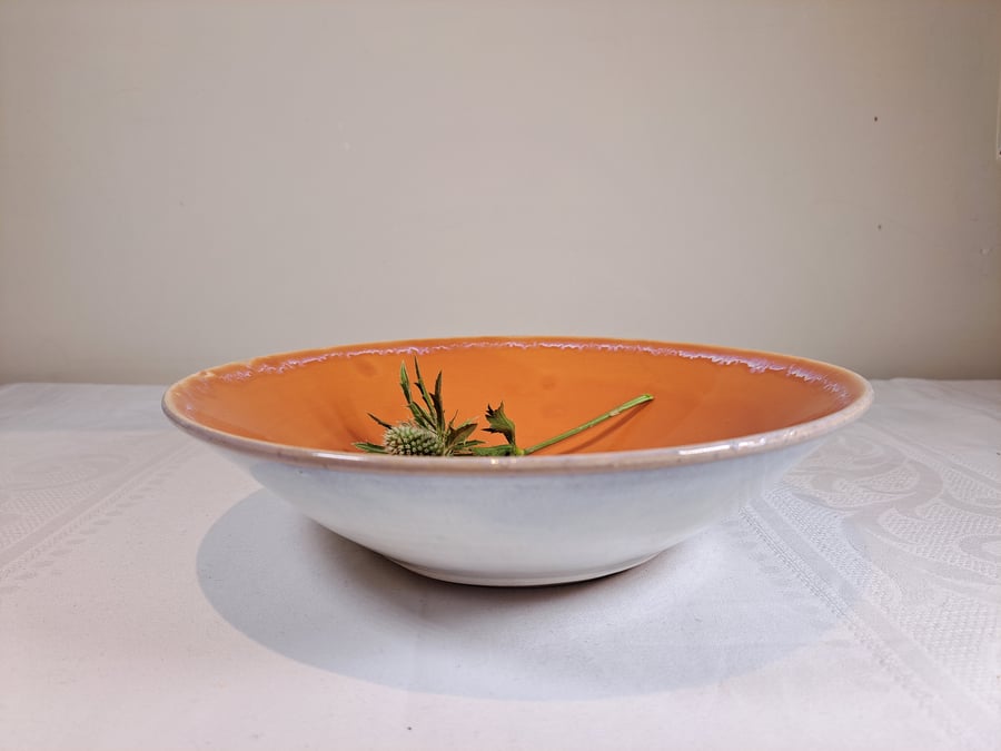  Burnt orange and off white ceramic bowl
