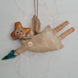 Handmade rustic angel christmas hanging decoration with orange stockings