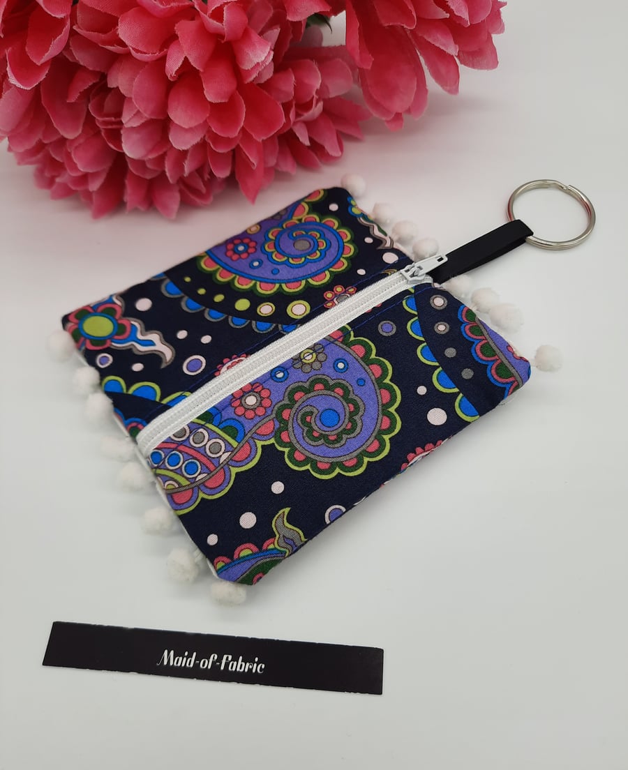 Coin purse keyring in navy patterned fabric. 