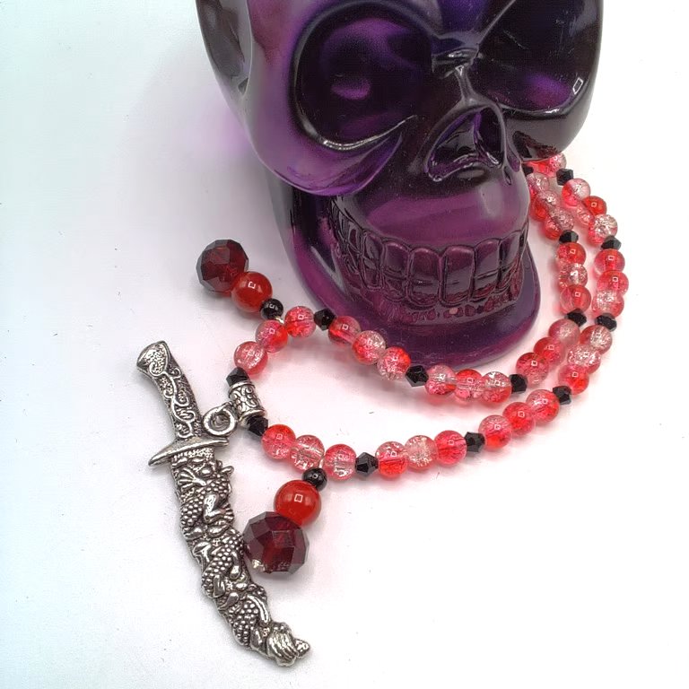 Silver Dagger Pendant on a Red Bead Necklace With Red and Black Bead Charms