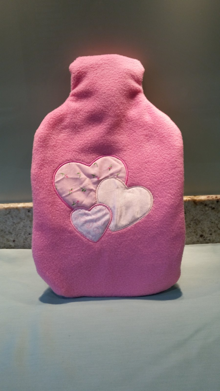 Hot water bottle & cover made from fleece with appliqued heart design