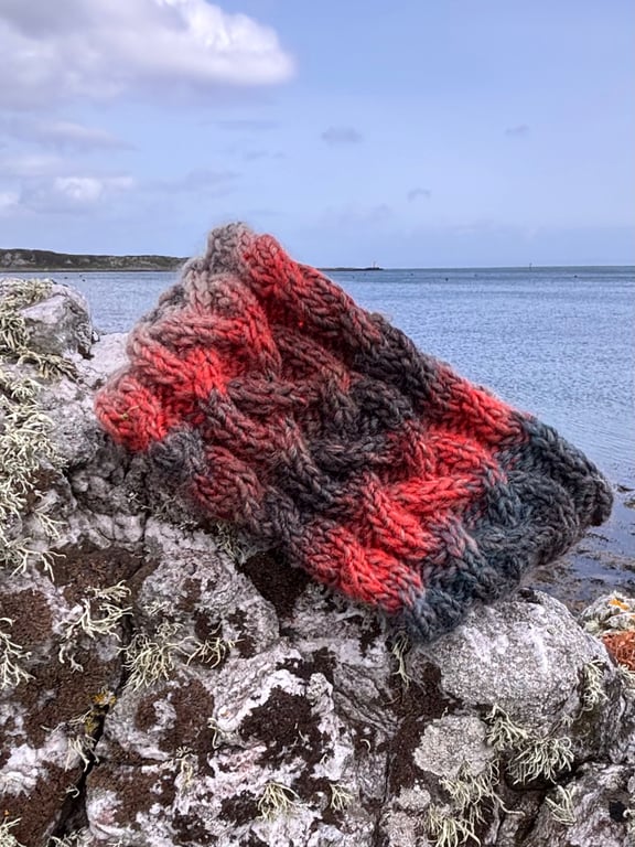 Hand knitted lined headband featuring Celtic knot pattern.