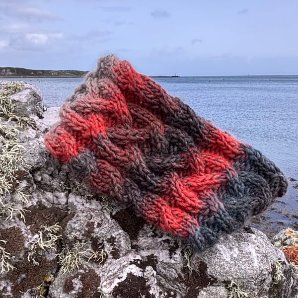 Hand knitted lined headband featuring Celtic knot pattern.