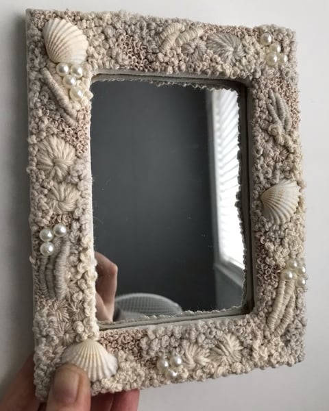 She sees shells and pearls a one of a kind mirror 
