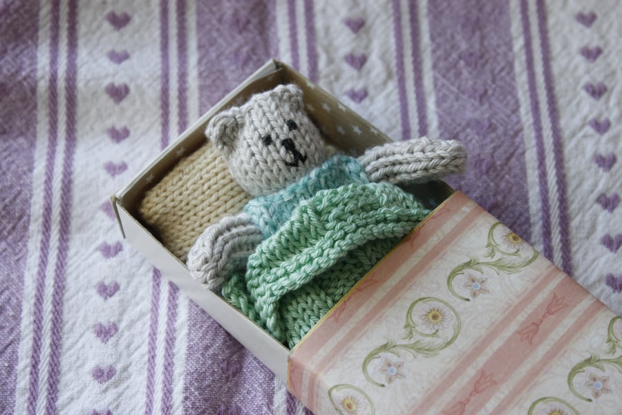 Knitted Ted in a Bed