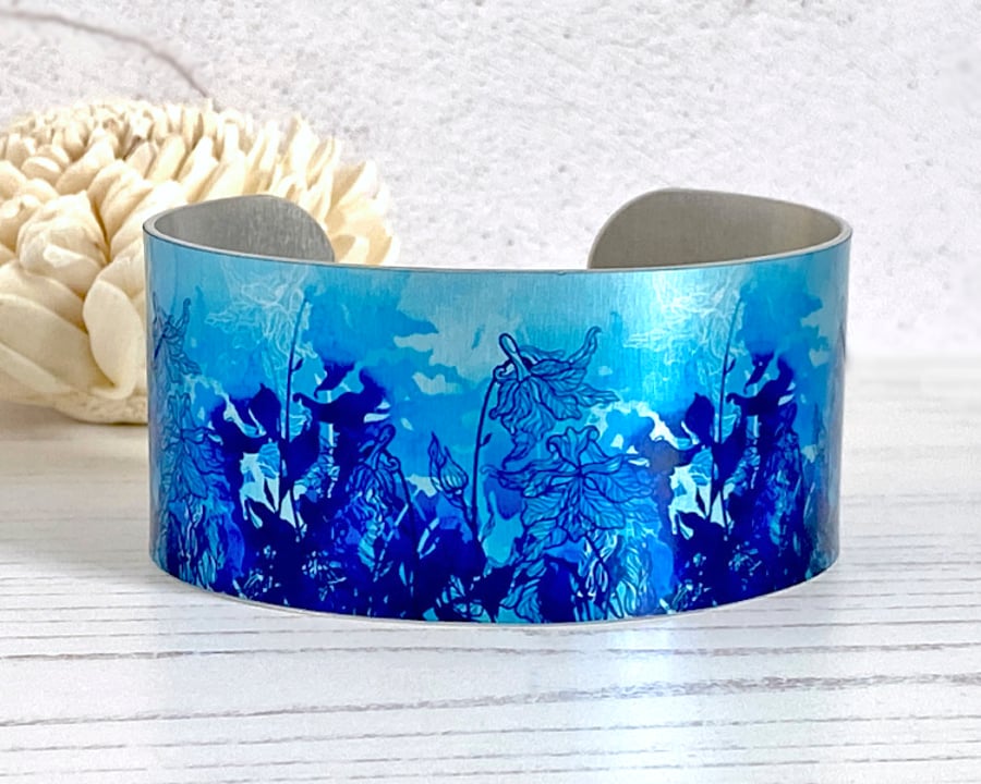 Blue wildflower wide cuff bracelet, metal jewellery bangle. (84)