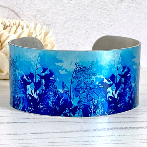 Blue wildflower wide cuff bracelet, metal jewellery bangle. (84)