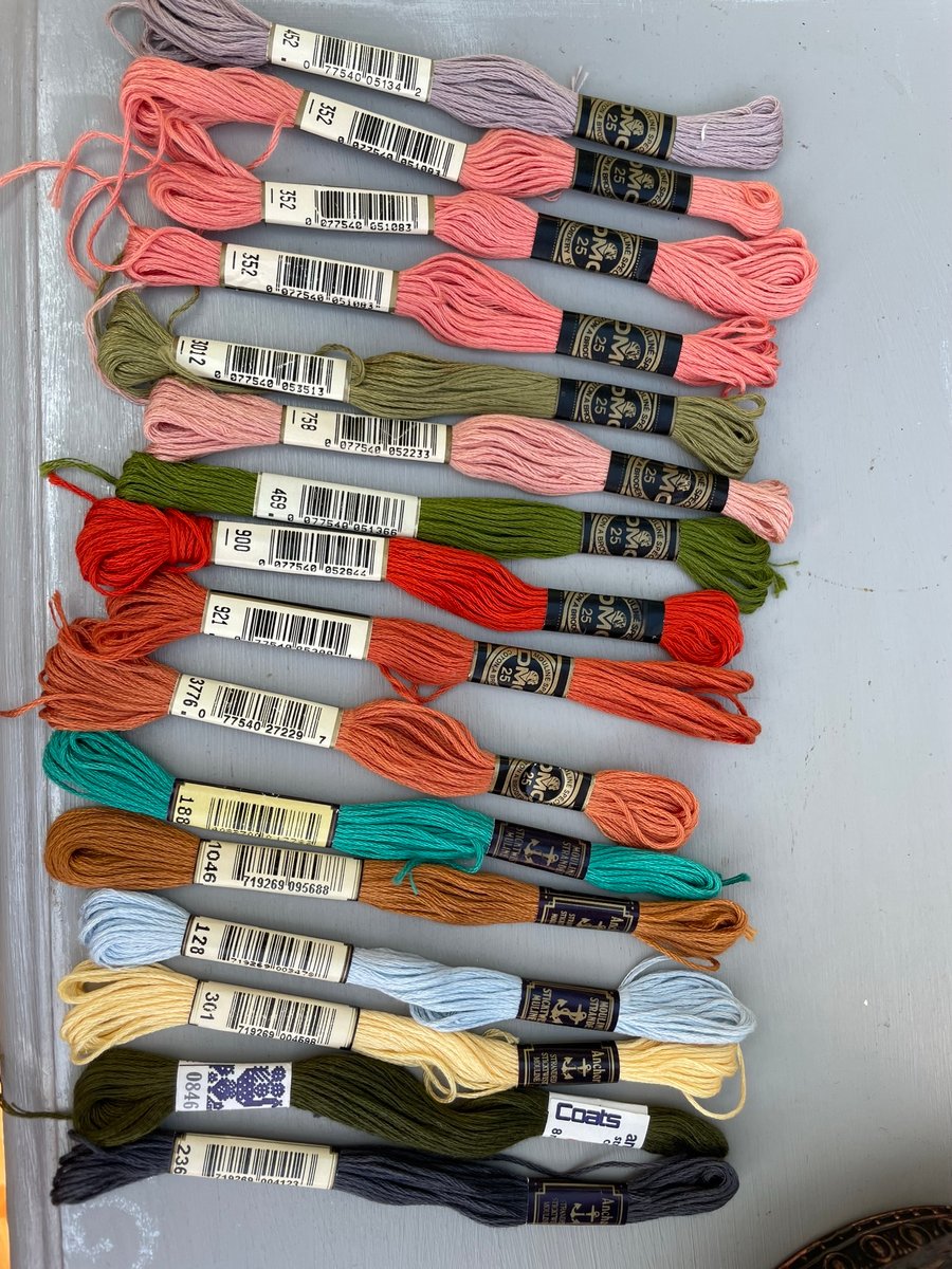 A bundle of 16 embroidery skeins by DMC and Anchor coats